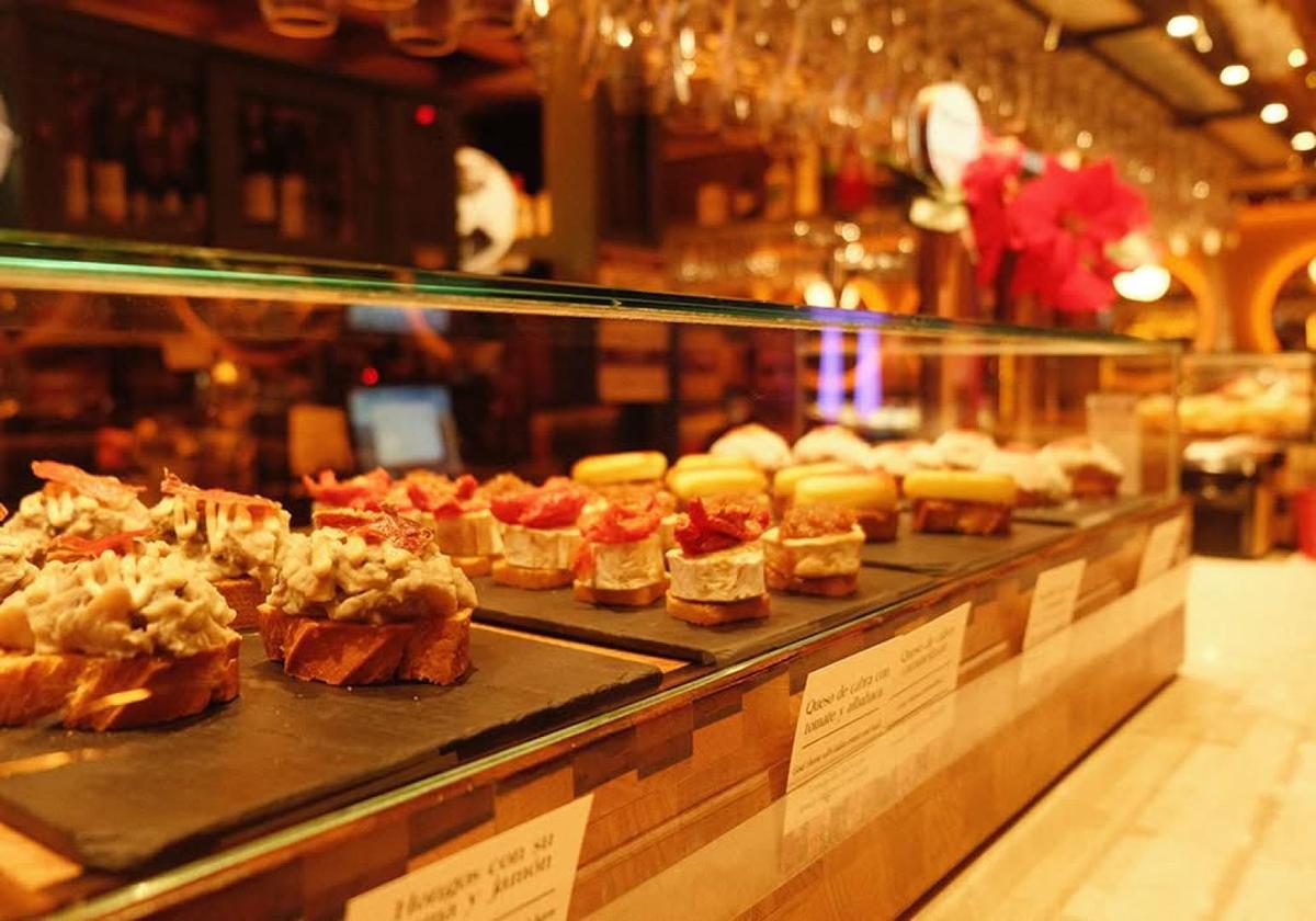 Selection of pintxos displayed at a bar in Bilbao