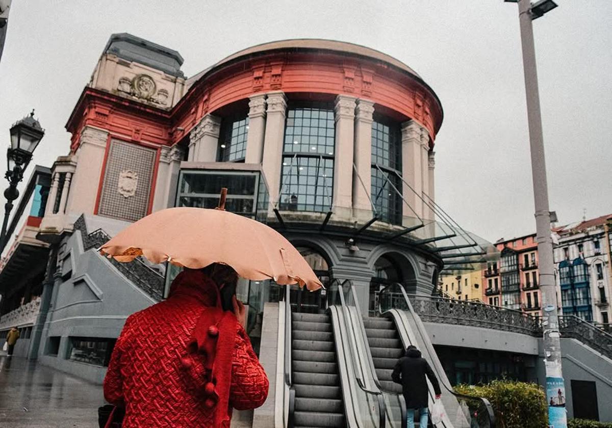 Street scene with an umbrella on a rainy day in Bilbao