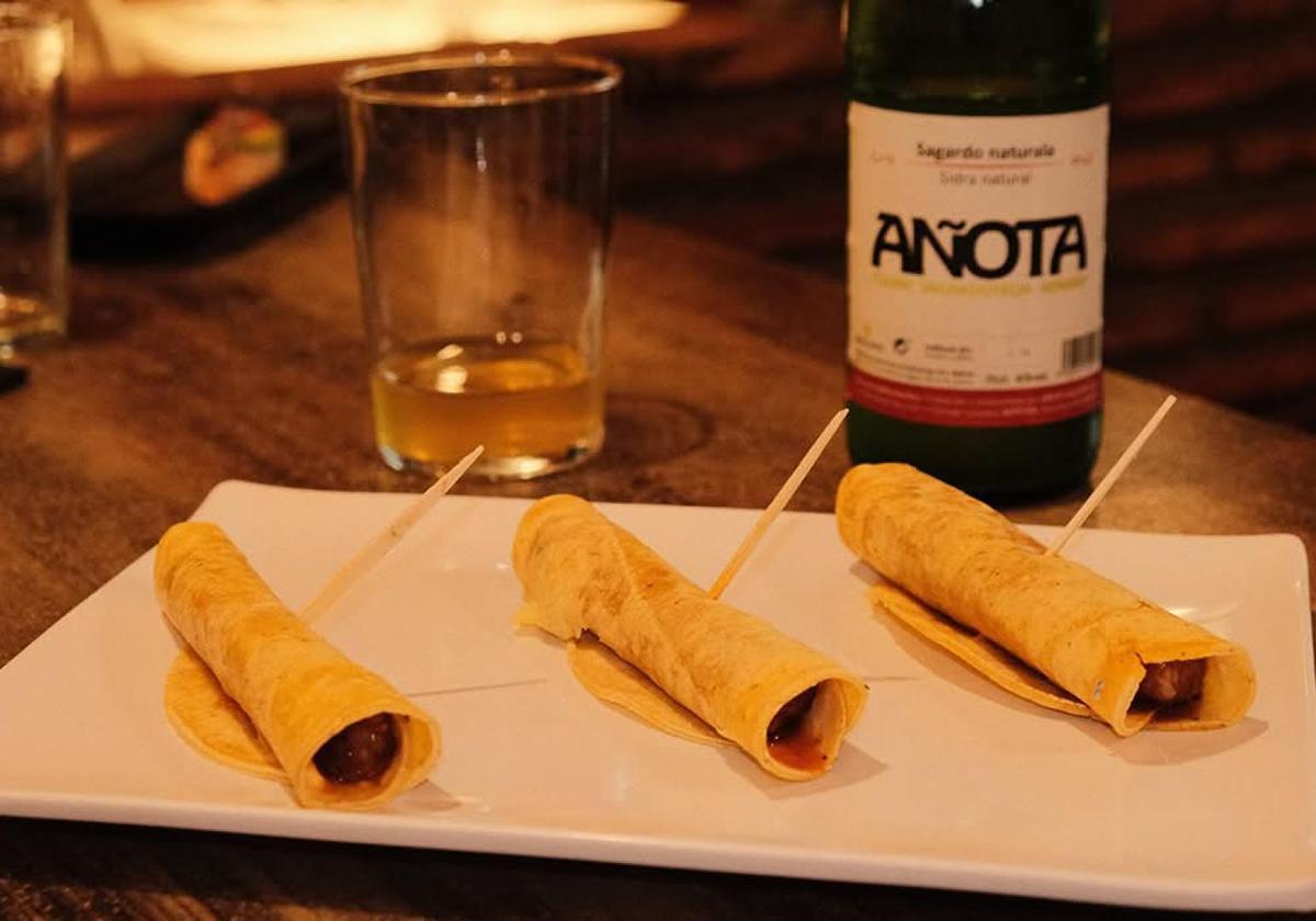 Wine bottle and glasses served with pintxos in Bilbao
