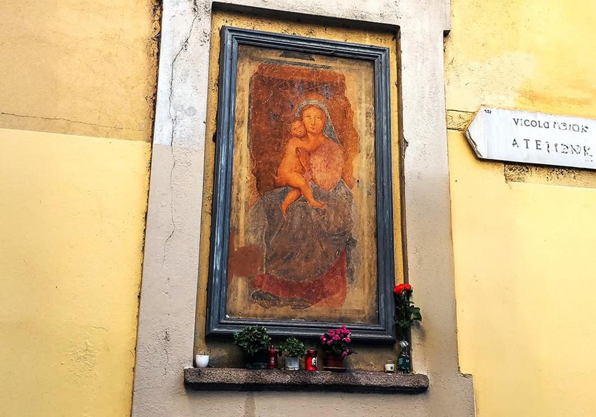 Historic religious artwork displayed inside a Milan building