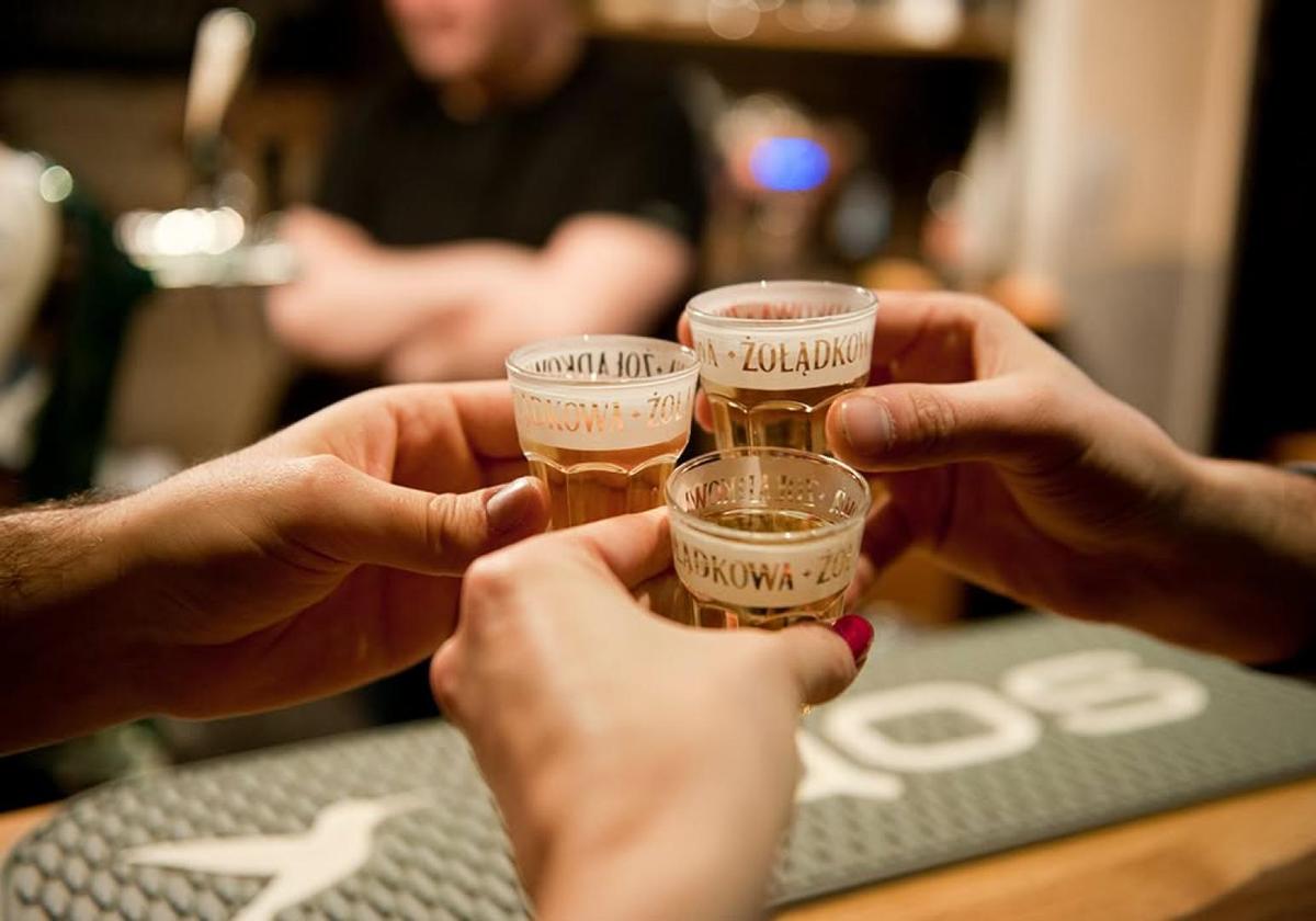 Guests taking shots of Polish vodka during the tasting