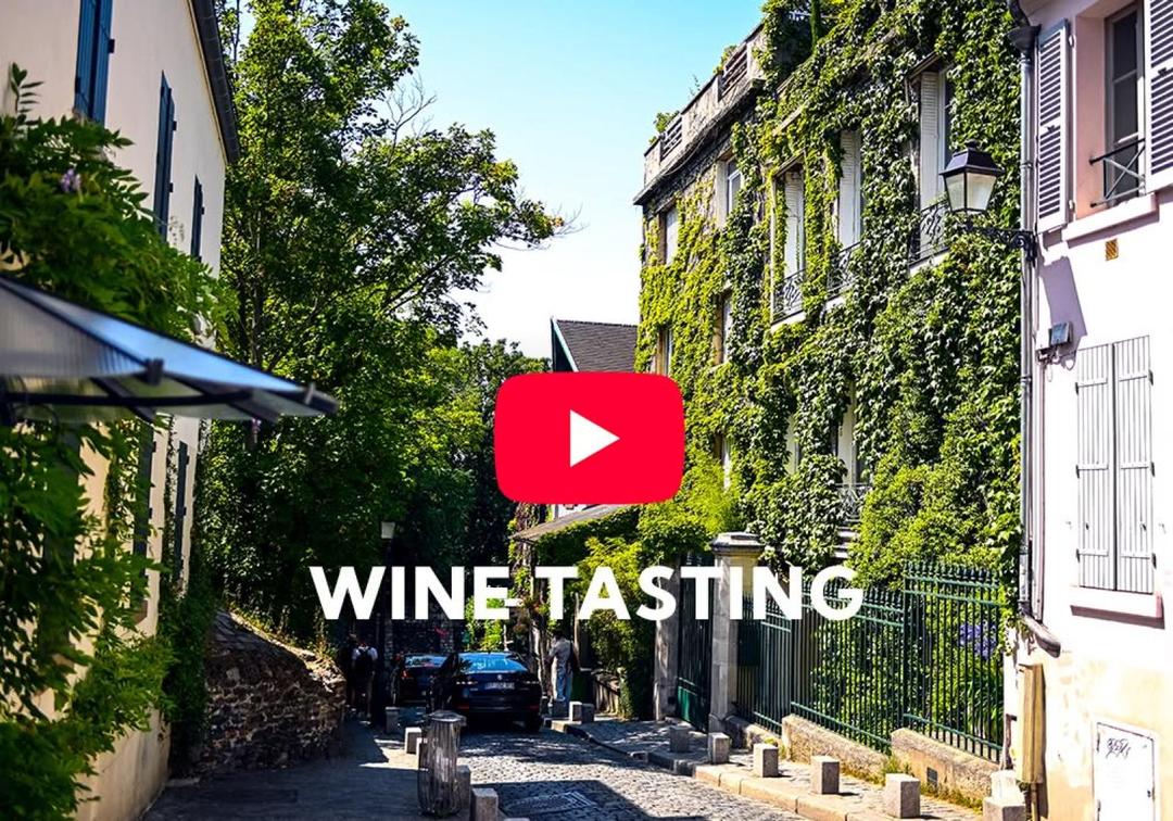Vine-covered Paris courtyard with wine tasting text, video thumbnail
