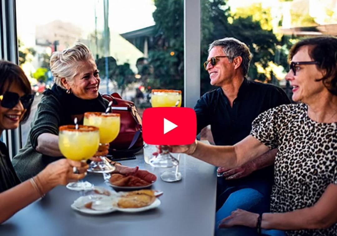 Guests enjoying food and drinks outside during the Lima tour, video thumbnail