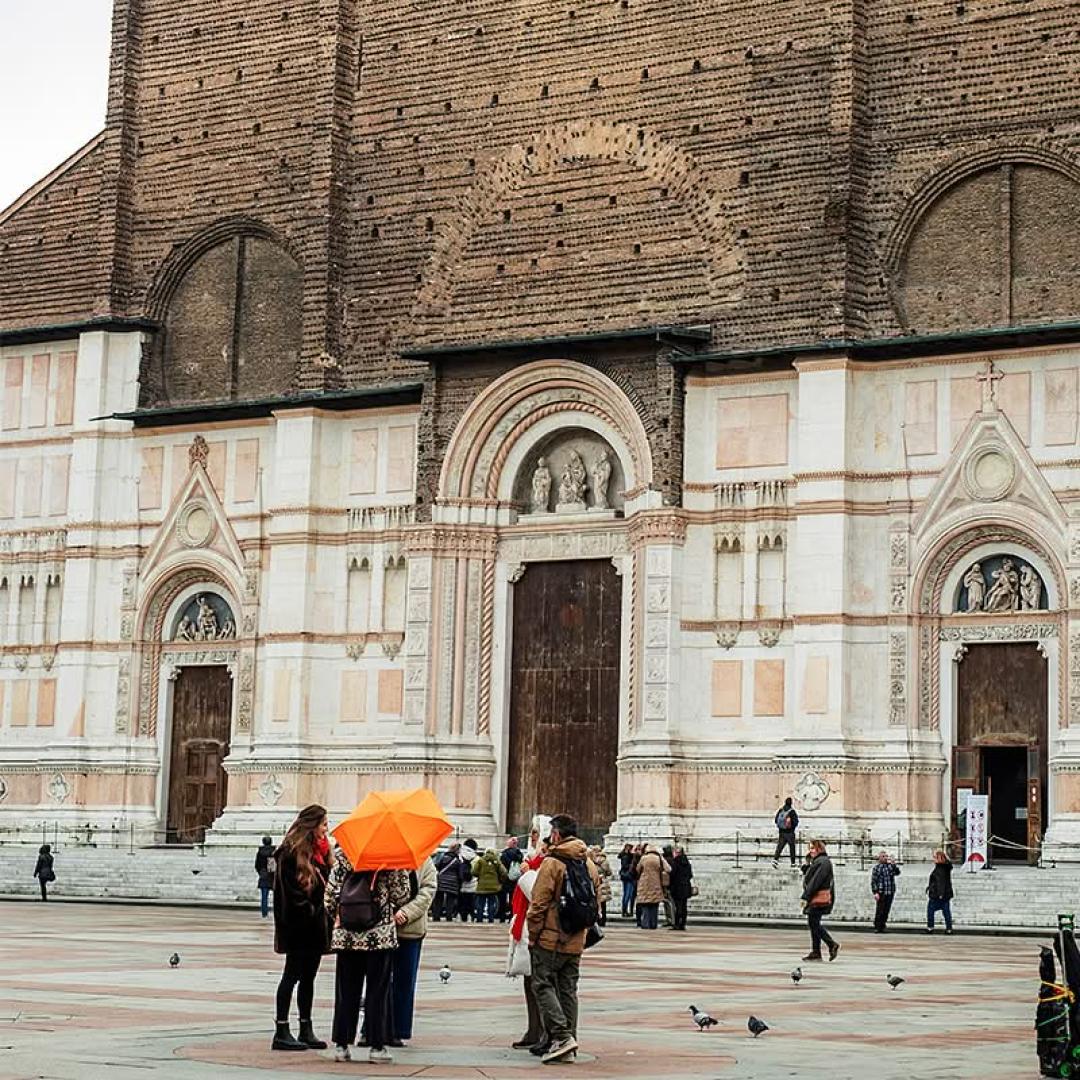 Secret Food Tours group exploring Piazza del Nettuno in Bologna