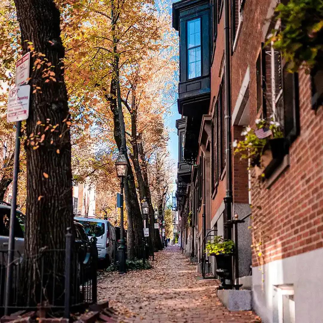 Historic North End Boston street with brick buildings and autumn trees